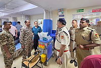 CJP Protest: Delhi Police Register 10 FIRs After Stone-Pelting Injures Officers at CP, Jantar Mantar | Photo: Handout via PTI : Special CP Crime Devesh Chandra Srivastava meets an injured policeman getting treatment at the Ram Manohar Lohia (RML) Hospital, in New Delhi. At least two assistant commissioners of police (ACPs) and four personnel were injured in a stone-pelting incident by protesters during an ongoing agitation by the Cockroach Janata Party (CJP) near Jantar Mantar on Wednesday evening, police sources said.