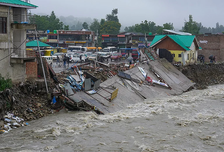 A damaged embankment along a swollen stream following floods and rainfall, in Khag area, Budgam district, Jammu and Kashmir, Wednesday, July 22, 2026. - | Photo: PTI/S Irfan