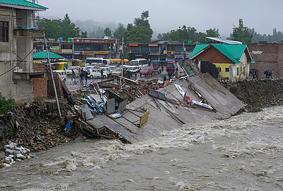 | Photo: PTI/S Irfan : A damaged embankment along a swollen stream following floods and rainfall, in Khag area, Budgam district, Jammu and Kashmir, Wednesday, July 22, 2026.