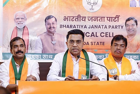 Goa Chief Minister Pramod Sawant addresses an event of the newly constituted party Goa Medical Cell, led by convener Dr Shekhar Salkar, at party headquarters, in Panaji. Goa party President Damodar G Naik, right, is also seen.