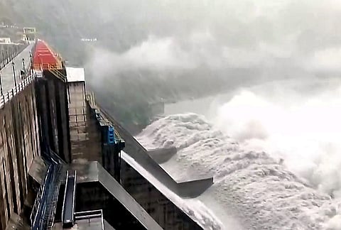 Water gushes through the opened gates of the Salal Dam as the Chenab river swells amid heavy rainfall, in Reasi district, Jammu and Kashmir.