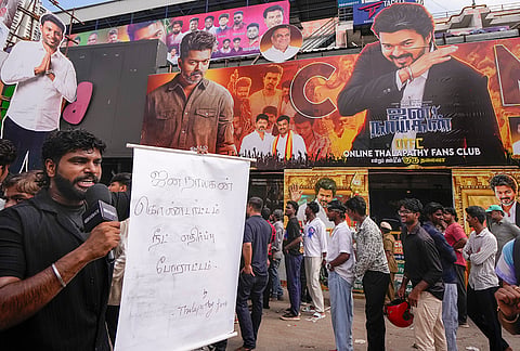 A man stages a protest over the alleged irregularities in the NEET examination inside a cinema hall during the theatrical release of film ‘Jana Nayagan' starring actor and Tamil Nadu Chief Minister Joseph Vijay, in Chennai, Thursday, July 23, 2026. 
