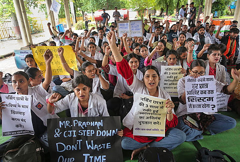 Students raise slogans during a protest expressing solidarity with the nationwide agitation over the alleged irregularities in the NEET examination, demanding the resignation of Union Education Minister Dharmendra Pradhan, in Bhopal, Thursday, July 23, 2026. 