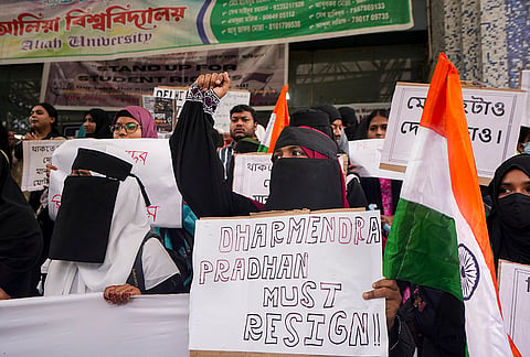 Aliah University students hold placards and raise slogans during a protest rally against the police action on students in the ‘Sansad chalo’ march in Delhi, and demand resignation of Union Education Minister Dharmendra Pradhan over the NEET paper leak issue, in Kolkata, West Bengal, Thursday, July 23, 2026. 