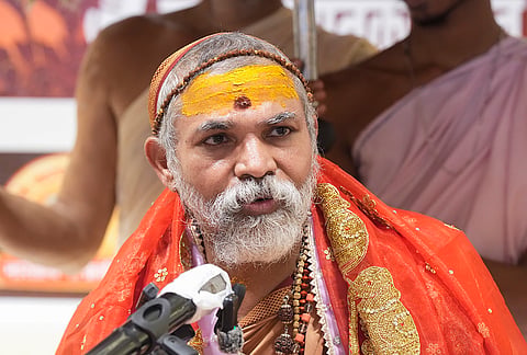 Swami Avimukteshwaranand Saraswati addresses a press conference, in Lucknow, Uttar Pradesh.