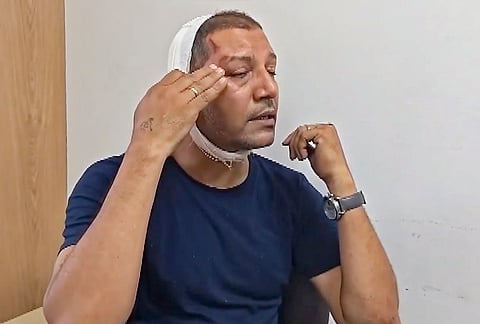 Delhi Police Inspector Nand Kishore Singh, who was injured in an alleged assault while heading for duty near Jantar Mantar, speaks about the incident, in New Delhi.