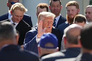 | Photo: AP/Alex Brandon : Speaking to reporters aboard Air Force One, Trump said the United States had been preparing for military action but was now pursuing negotiations instead.