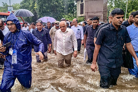 Gujarat Chief Minister Bhupendra Patel along with state Minister Rushikesh Patel inspect waterlogged areas following heavy rainfall, in Ahmedabad, Gujarat.