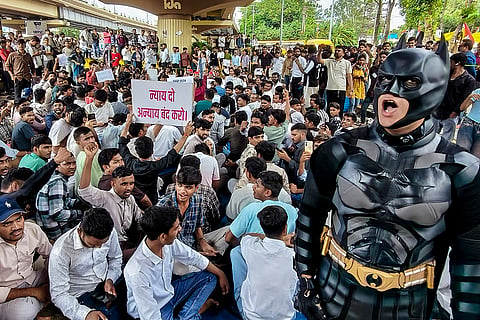 A demonstrator dressed as Batman during a protest against NEET paper leak issue, in Indore, Madhya Pradesh.