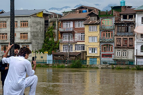 Partially submerged submerged residential houses on the banks of River Jhelum as water level rises following the incessant rainfall, in Srinagar, Jammu and Kashmir.