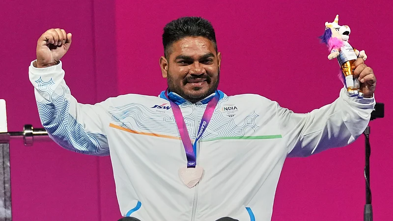 (AP Photo/Eranga Jayawardena) : Indias Jhandu Kumar celebrates his bronze medal won in the mens heavy weight para power lifting during the Commonwealth Games in Glasgow, Scotland, Friday, July 24, 2026