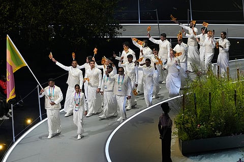 The team from Sri Lanka arrives on stage during the Commonwealth Games opening ceremony in Glasgow, Scotland.