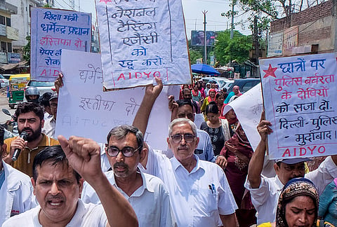 Workers of various organisations stage a protest demanding the resignation of Union Education Minister Dharmendra Pradhan over the NEET paper leak issue and against the police action on the students in the 'Sansad chalo' march, in Gurugram, Haryana.

