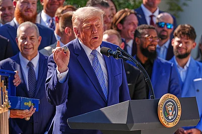 | Photo: AP/Julia Demaree Nikhinson : President Donald Trump holds a LA Dodgers Championship Ring during an event to honor the 2025 World Series champions Los Angeles Dodgers in the Rose Garden of the White House in Washington.