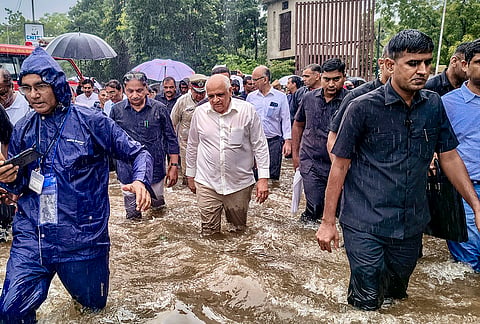 Gujarat Chief Minister Bhupendra Patel along with state Minister Rushikesh Patel inspect waterlogged areas following heavy rainfall, in Ahmedabad, Gujarat.

