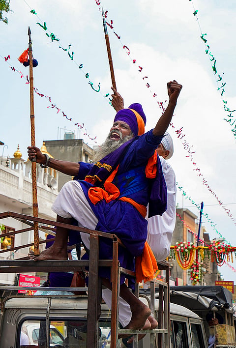 'Nihang' sikhs take part in a march marking 'Miri Piri Diwas', a major festival commemorating the day when the sixth sikh Guru Hargobind donned two swords representing temporal power (Miri) and spiritual authority (Piri), at the Golden Temple, in Amritsar.