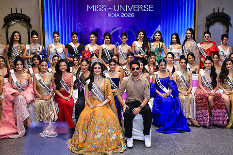 Miss Universe India 2025 Manika Vishwakarma, Owner and Director of Miss Universe India Nikhil Anand with finalists pose for photographs during a media interaction ahead of the Miss Universe India 2026 Gala Round and Welcome Ceremony, in Jaipur, Rajasthan.
