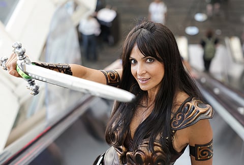 Amelia Benmerad of France dressed as Xena poses for a photograph during Comic-Con International in San Diego. 