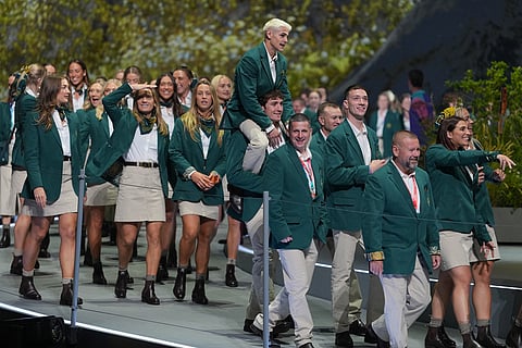 Members of the Australian team reacts as the walk on stage during the Commonwealth Games opening ceremony in Glasgow, Scotland.