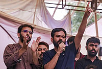 | Photo: PTI : Cockroach Janta Party (CJP) founder Abhijeet Dipke addresses the ongoing protest demanding the resignation of Union Education Minister Dharmendra Pradhan over NEET paper leak issue, at Jantar Mantar, in New Delhi. CJP spokesperson Ashutosh Ranka, left, is also present. 