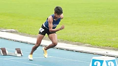 Tahura Khatun running on a track during an event. - insta/tahurakhatun400
