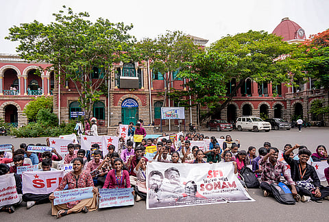 Members of Students' Federation of India (SFI) Presidency College unit hold placards and banners during a protest at the campus premises demanding the resignation of Union Education Minister Dharmendra Pradhan over the NEET paper leak issue, in Chennai, Tamil Nadu.