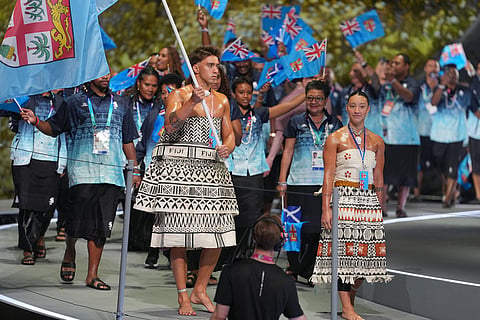 The team from Fiji arrives onstage during the Commonwealth Games opening ceremony in Glasgow, Scotland.