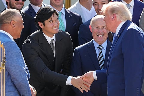 President Donald Trump shakes hands with Los Angeles Dodgers Shohei Ohtani during an event to honor the 2025 World Series champions Los Angeles Dodgers in the Rose Garden of the White House in Washington.