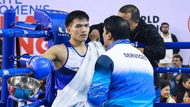 Indian Boxer Jadumani Singh receiving instructions from his corner during a boxing match. - Insta/boxermani_jr