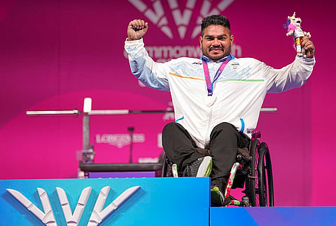 India's Jhandu Kumar celebrates after winning the bronze medal during the medal ceremony for the men's heavyweight para powerlifting event at the Commonwealth Games 2026, in Glasgow, Friday, July 24, 2026. 