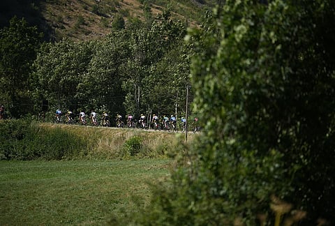 The pack rides during the nineteenth stage of the Tour de France cycling race with start in Gap and finish in Alpe d'Huez, France, Friday, July 24, 2026. 
