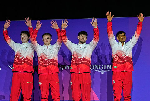 England team members celebrate after winning the Silver medal in the men's artistic gymnastics team final at the Commonwealth Games in Glasgow, Scotland, Friday, July 24, 2026. 
