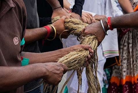Devotees hold the rope as they pull the chariots carrying Hindu deities Lord Jagannath, Subhadra and Balaram during the return of chariot festival, which marks the end of the nine-day long chariot festival, in Kolkata, India, Friday, July 24, 2026.