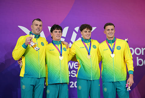 Australia's men's 4x100 meter freestyle relay swimming team of Flynn Southam, Kai Taylor, Harrison Turner and Kyle Chalmers pose with their gold medals during the medal ceremony at the Commonwealth Games in Glasgow, Scotland, Friday, July 24, 2026. 