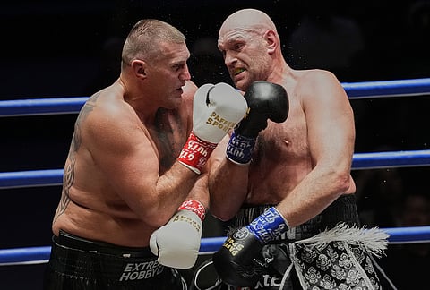 Tyson Fury, of England, right, and Mariusz Wach of Poland battle during a heavyweight charity bout at Max Muay Thai Stadium in Pattaya, Thailand, Friday, July 24, 2026.