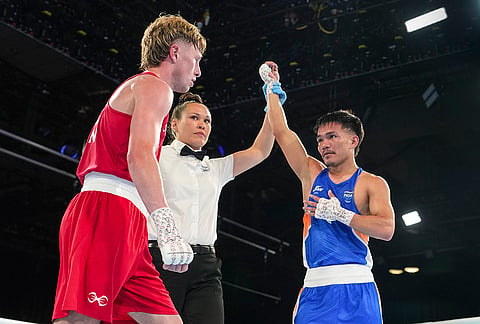 India's Jadumani Singh Mandengbam (blue) is declared the winner over Scotland's Aaron Cullen after their men's 55kg Round of 32 boxing bout at the Commonwealth Games 2026, in Glasgow. Jadumani won the contest by a 5-0 unanimous decision to advance to the Round of 16. 