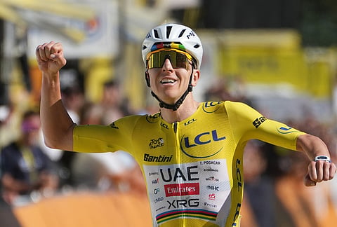 Slovenia's Tadej Pogacar, wearing the overall leader's yellow jersey, reacts as he crosses the finish line to win the nineteenth stage of the Tour de France cycling race with start in Gap and finish in Alpe d'Huez, France, Friday, July 24, 2026.