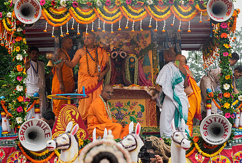A priest of The International Society of Krishna Consciousness (ISKCON) worships the Hindu deity Lord Jagannath, during the return of chariots, which marks the end of the nine-day long chariot festival, in Kolkata, India, Friday, July 24, 2026.