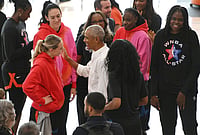 | Photo: AP/Paul Beaty : Former President Barack Obama greets WNBA All-Star Paige Bueckers, left, during a practice at the Obama Presidential Center in Chicago, Friday, July 24, 2026. 