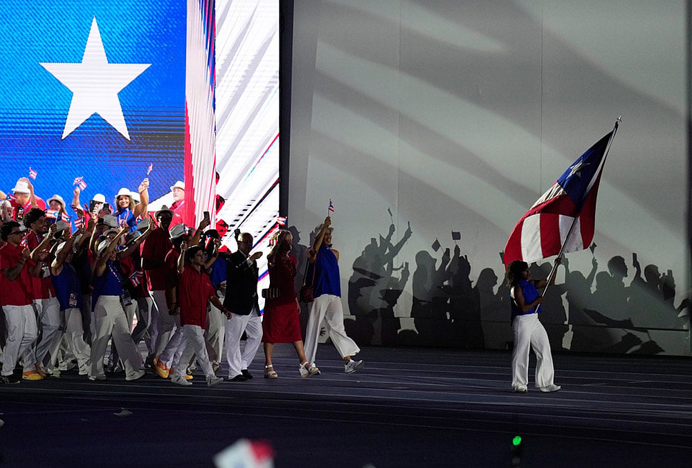 Athletes of Puerto Rico parade during the opening ceremony of the Central American and Caribbean Games in Santo Domingo, Dominican Republic, Friday, July 24, 2026. 
