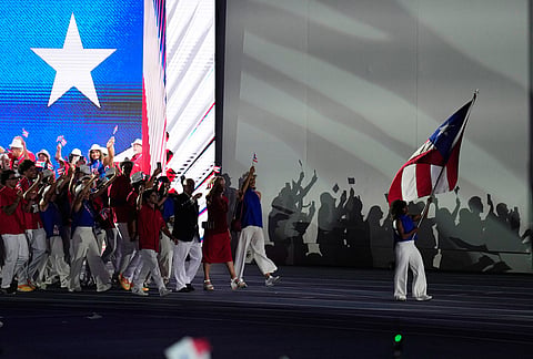 Athletes of Puerto Rico parade during the opening ceremony of the Central American and Caribbean Games in Santo Domingo, Dominican Republic, Friday, July 24, 2026. 
