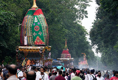 Devotees throng around the chariots carrying Hindu deities Lord Jagannath, Subhadra and Balaram, which marks the end of the nine-day long chariot festival, in Kolkata, India, Friday, July 24, 2026. 
