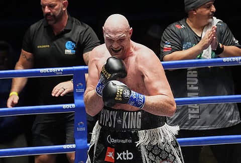 Tyson Fury, of England, celebrate after winning against Mariusz Wach of Poland during a heavyweight charity bout at Max Muay Thai Stadium in Pattaya, Thailand, Friday, July 24, 2026. 
