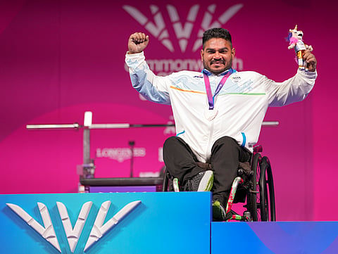 India's Jhandu Kumar celebrates after winning the bronze medal during the medal ceremony for the men's heavyweight para powerlifting event at the Commonwealth Games 2026, in Glasgow, Friday, July 24, 2026.