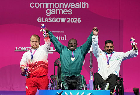 Winners of the men's heavy weight para powerlifting gold medalist Nigeria's Riluwan Idris, center, silver medalist England's Mathew Harding, left, and bronze medalist India's Jhandu Kumar celebrate during the Commonwealth Games in Glasgow, Scotland, Friday, July 24, 2026.