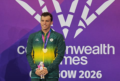 Nathan Hendricks of South Africa with his gold medal for winning the final of the men's 100 meter freestyle S13 swimming event during the medal ceremony at the Commonwealth Games in Glasgow, Scotland, Friday, July 24, 2026. 