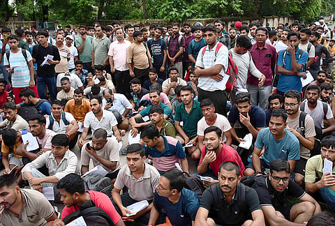 Applicants arrive to appear for the Physical Efficiency Test (PET) for the 7th CPC Pay Matrix Level 1 posts (Railway Group D) conducted by the Railway Recruitment Boards (RRBs) and Railway Recruitment Cells (RRCs), in Prayagraj, Uttar Pradesh.