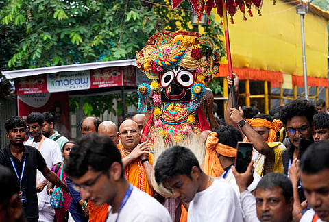 Devotees of International Society of Krishna Consciousness (ISKCON) carry the idol of Jagannath during the return of chariots carrying Hindu deities Lord Jagannath, Subhadra and Balaram, which marks the end of the nine-day long chariot festival, in Kolkata, India, Friday, July 24, 2026. 
