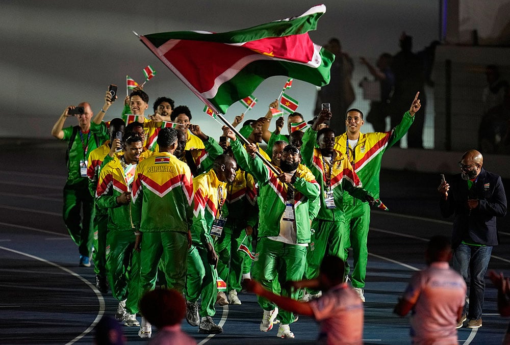Athletes of Suriname parade during the opening ceremony of the Central American and Caribbean Games in Santo Domingo, Dominican Republic, Friday, July 24, 2026. 
