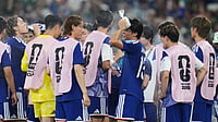 AP Photo/Matias Delacroix : Japan's players refresh themselves during the hydration break at the World Cup Group F soccer match against Tunisia in Guadalupe, near Monterrey, Mexico, Saturday, June 20, 2026.